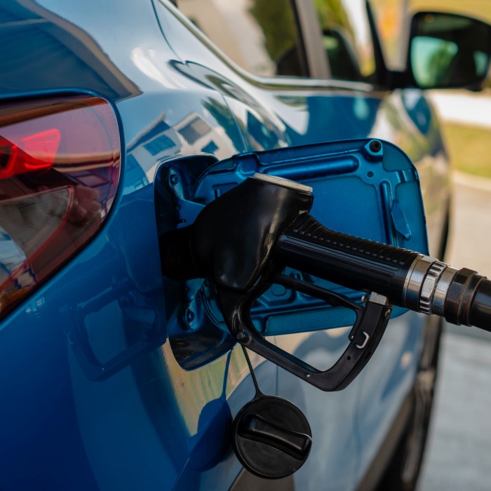 blue-car-refueling-at-gas-station-pump-2026-03-24-13-01-46-utc